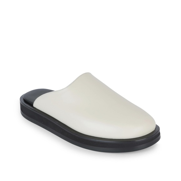 The Row Shoes - The Row Cream Leather Slide Mules with Black Sole